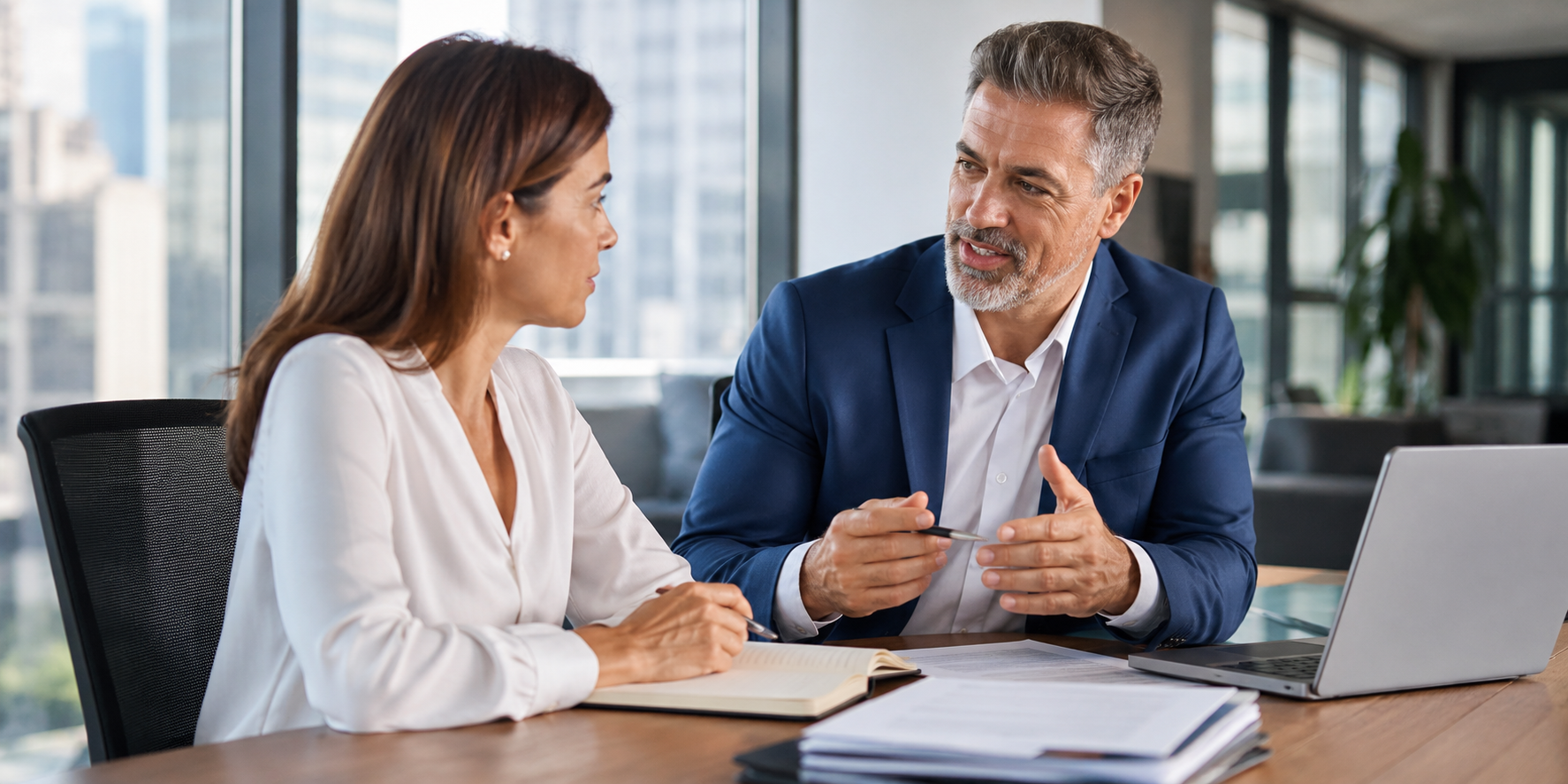 Financial advisor meeting with a client in an office